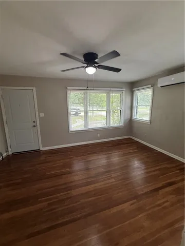 a kitchen with a sink and white cabinets