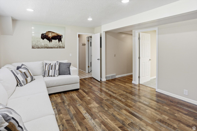 8938 Manchester Lane Sandy, UT 84093 - Photo 25 of 50 Interior room featuring wood-finish flooring, recessed lighting, and neutral wall tones