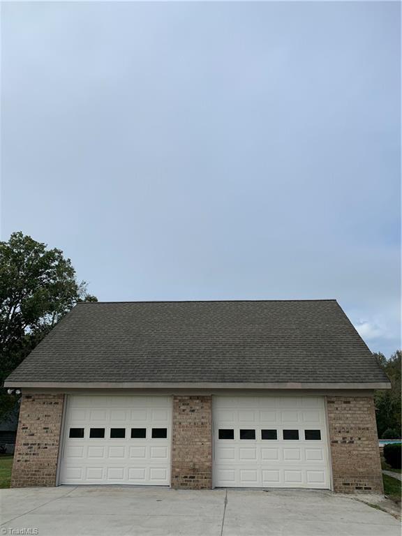 7024 Riverside Road Seagrove, NC 27341 - Photo 2 of 16 Detached two car garage with storage room.