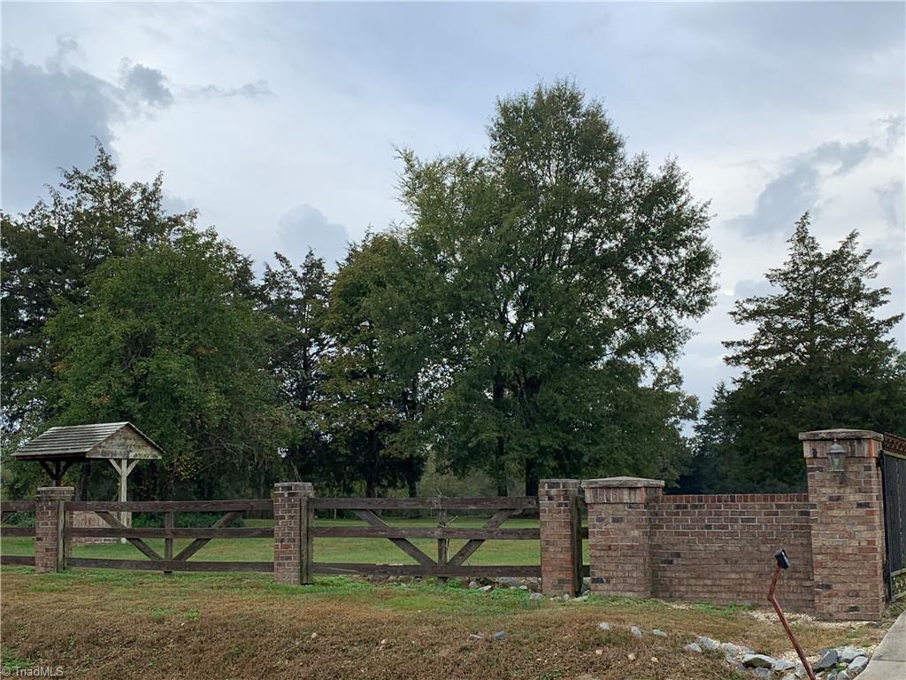 7024 Riverside Road Seagrove, NC 27341 - Photo 3 of 16 Left side of the privacy fence in front of the home.