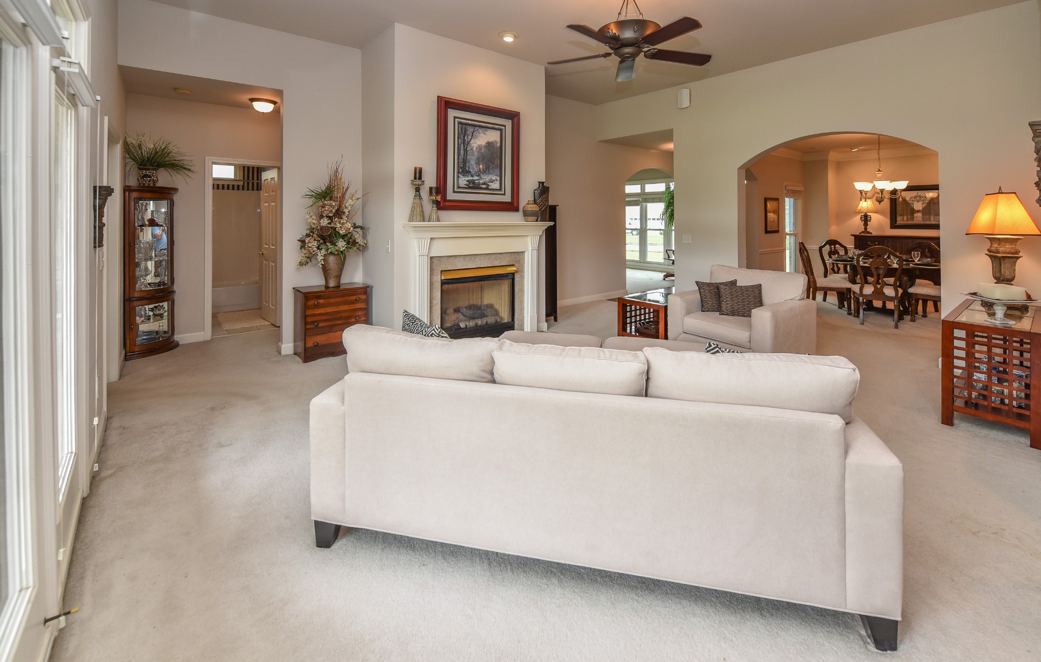 157 Stoners Glen Road Hermitage, TN 37076 - Photo 13 of 24 a living room with furniture a fireplace and a chandelier