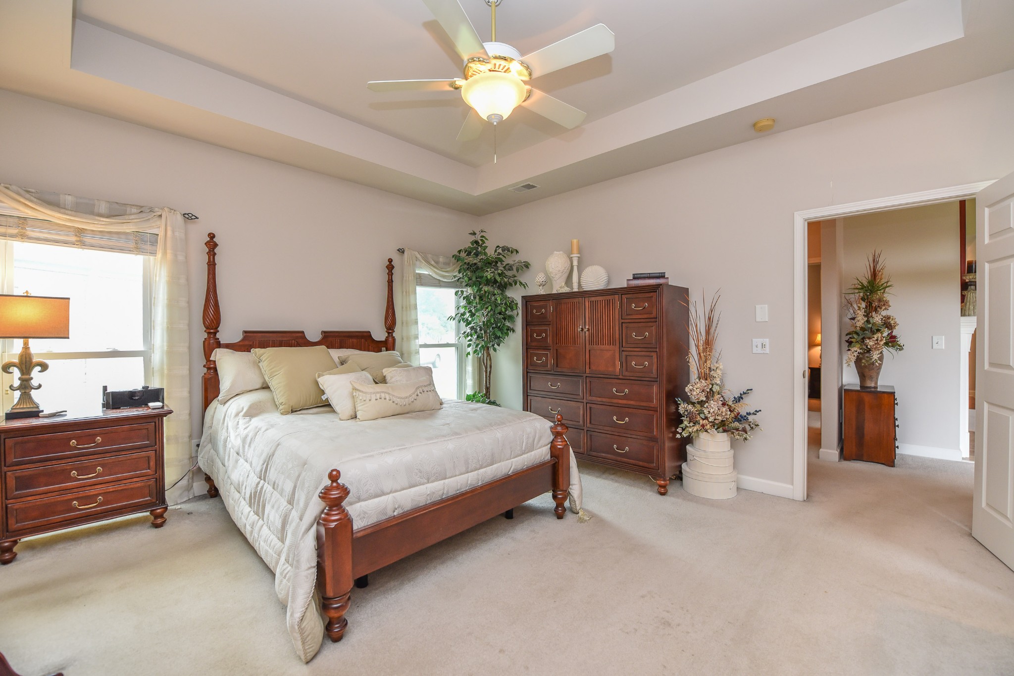 157 Stoners Glen Road Hermitage, TN 37076 - Photo 16 of 24 a bedroom with a bed and a chandelier