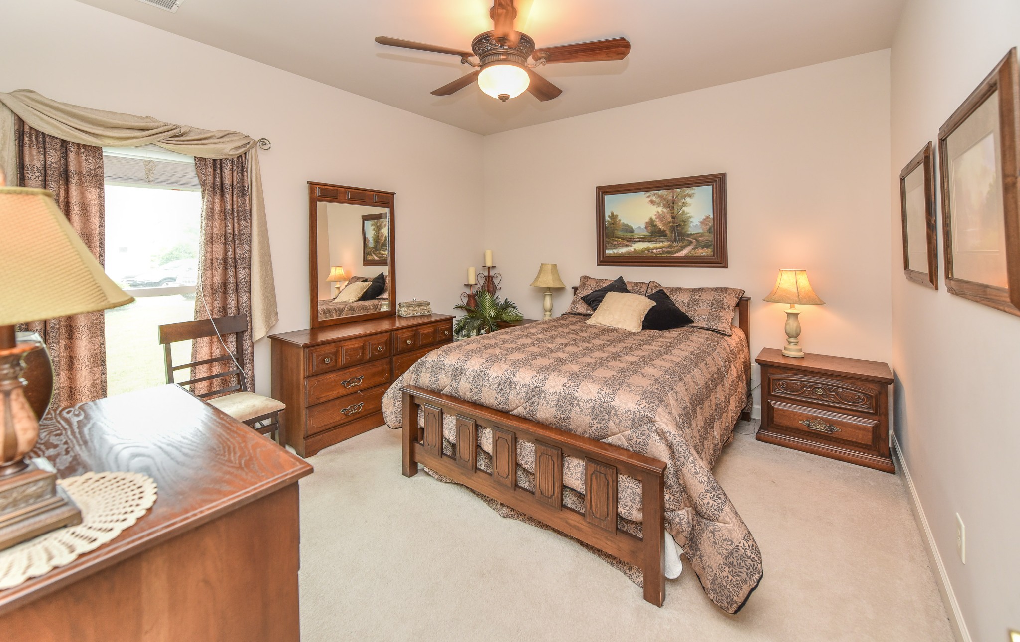 157 Stoners Glen Road Hermitage, TN 37076 - Photo 19 of 24 a bedroom with a bed a dresser and next to a window
