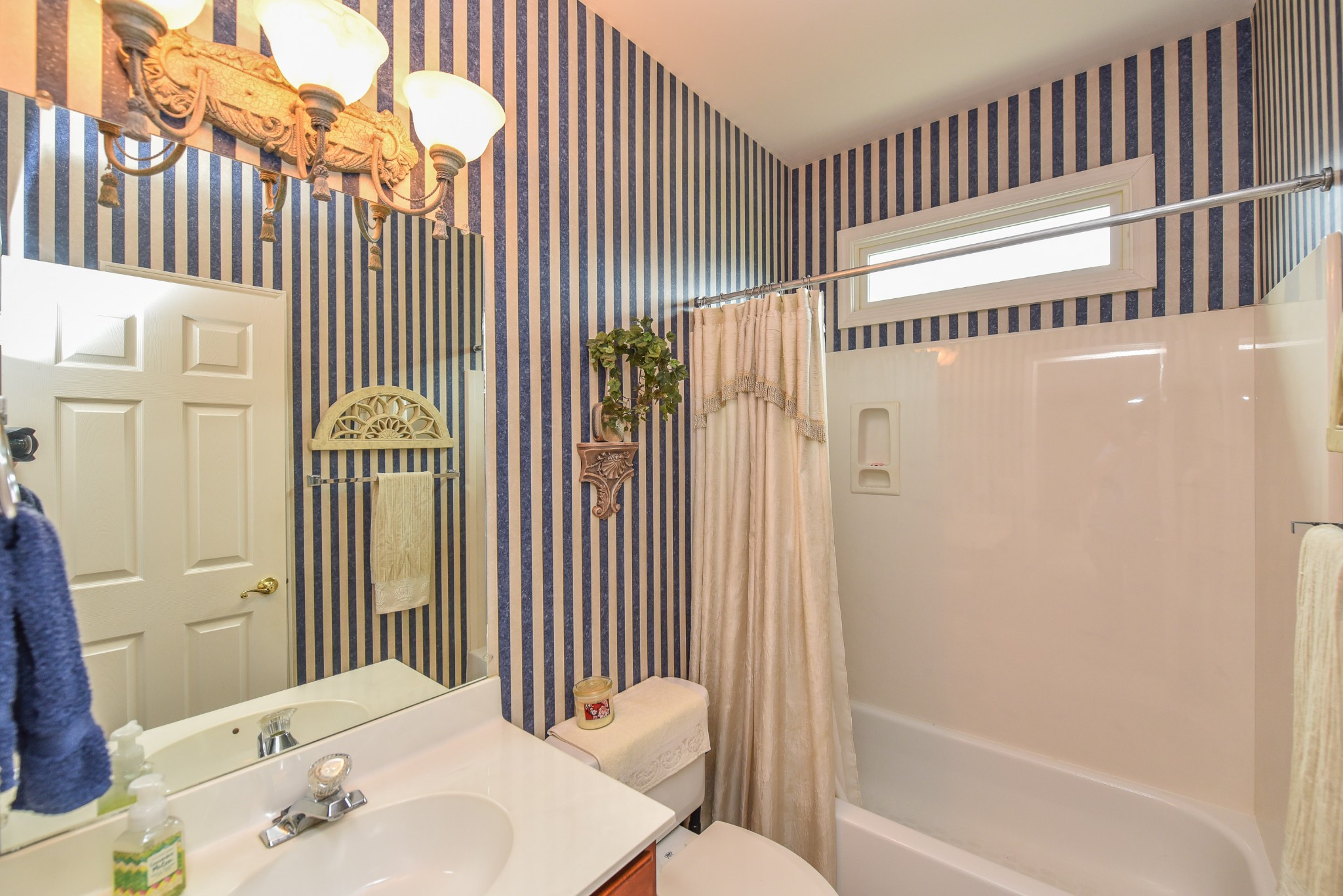 157 Stoners Glen Road Hermitage, TN 37076 - Photo 20 of 24 a bathroom with a sink and a mirror