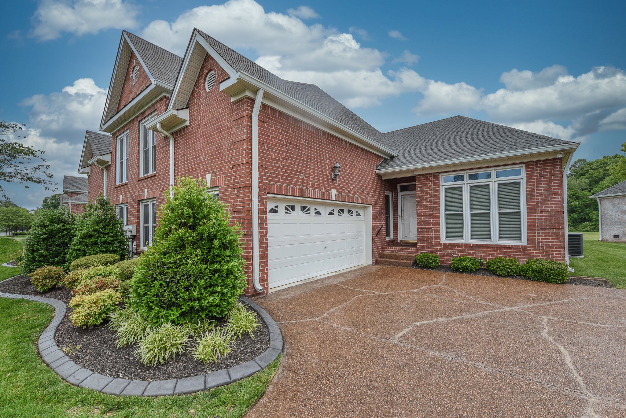157 Stoners Glen Road Hermitage, TN 37076 - Photo 2 of 24 a view of a house with a yard potted plants and a garage