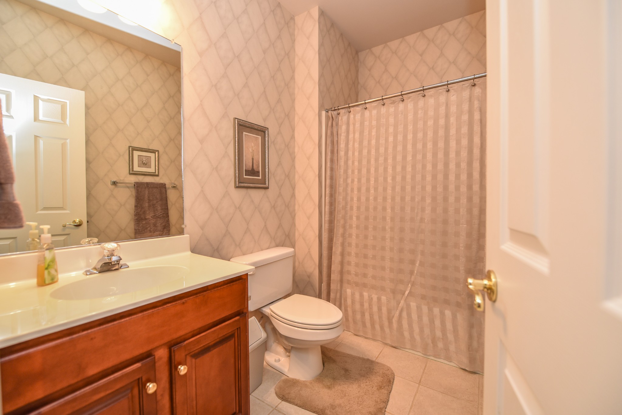 157 Stoners Glen Road Hermitage, TN 37076 - Photo 23 of 24 a bathroom with a sink a toilet and shower