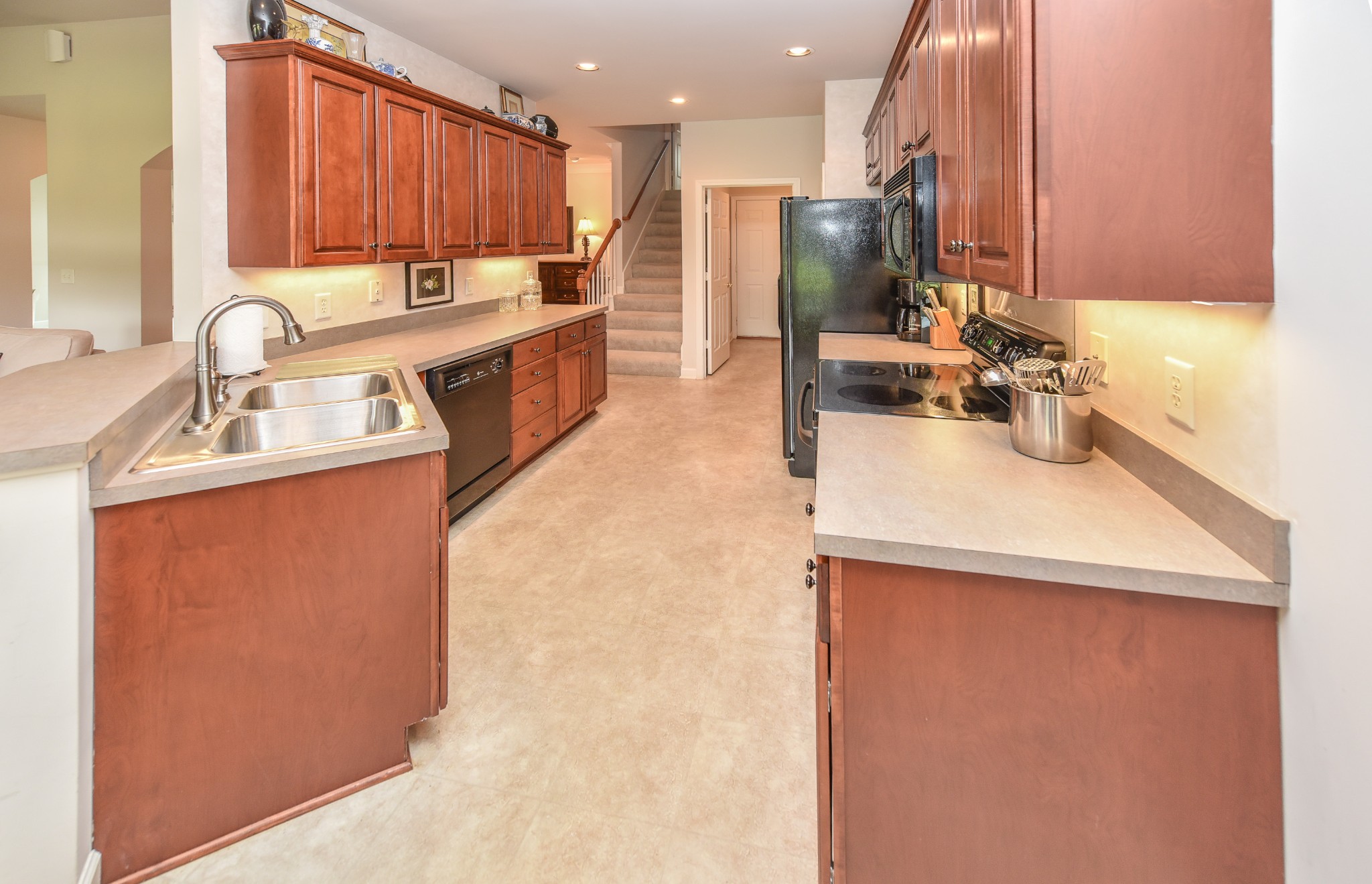 157 Stoners Glen Road Hermitage, TN 37076 - Photo 6 of 24 a kitchen with kitchen island a sink appliances and cabinets