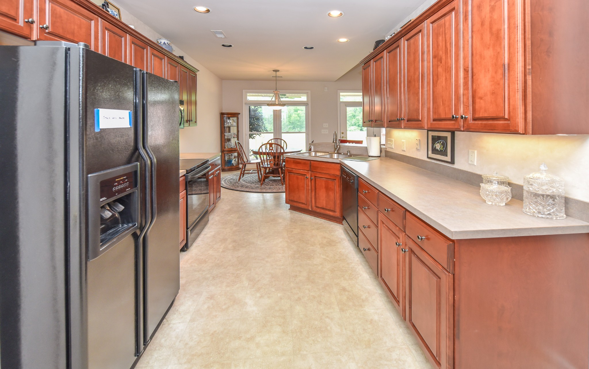 157 Stoners Glen Road Hermitage, TN 37076 - Photo 8 of 24 a kitchen with stainless steel appliances granite countertop a refrigerator a sink and a stove
