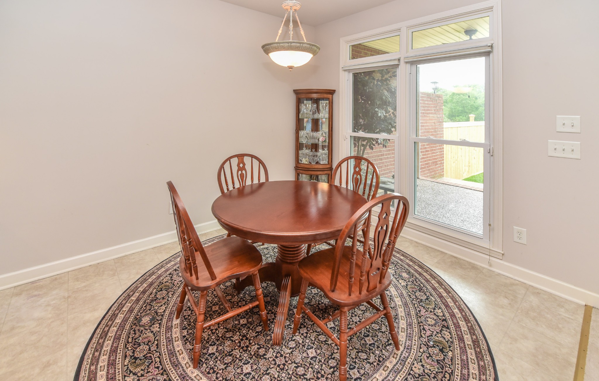 157 Stoners Glen Road Hermitage, TN 37076 - Photo 9 of 24 a dining room with furniture wooden floor a rug and a chandelier