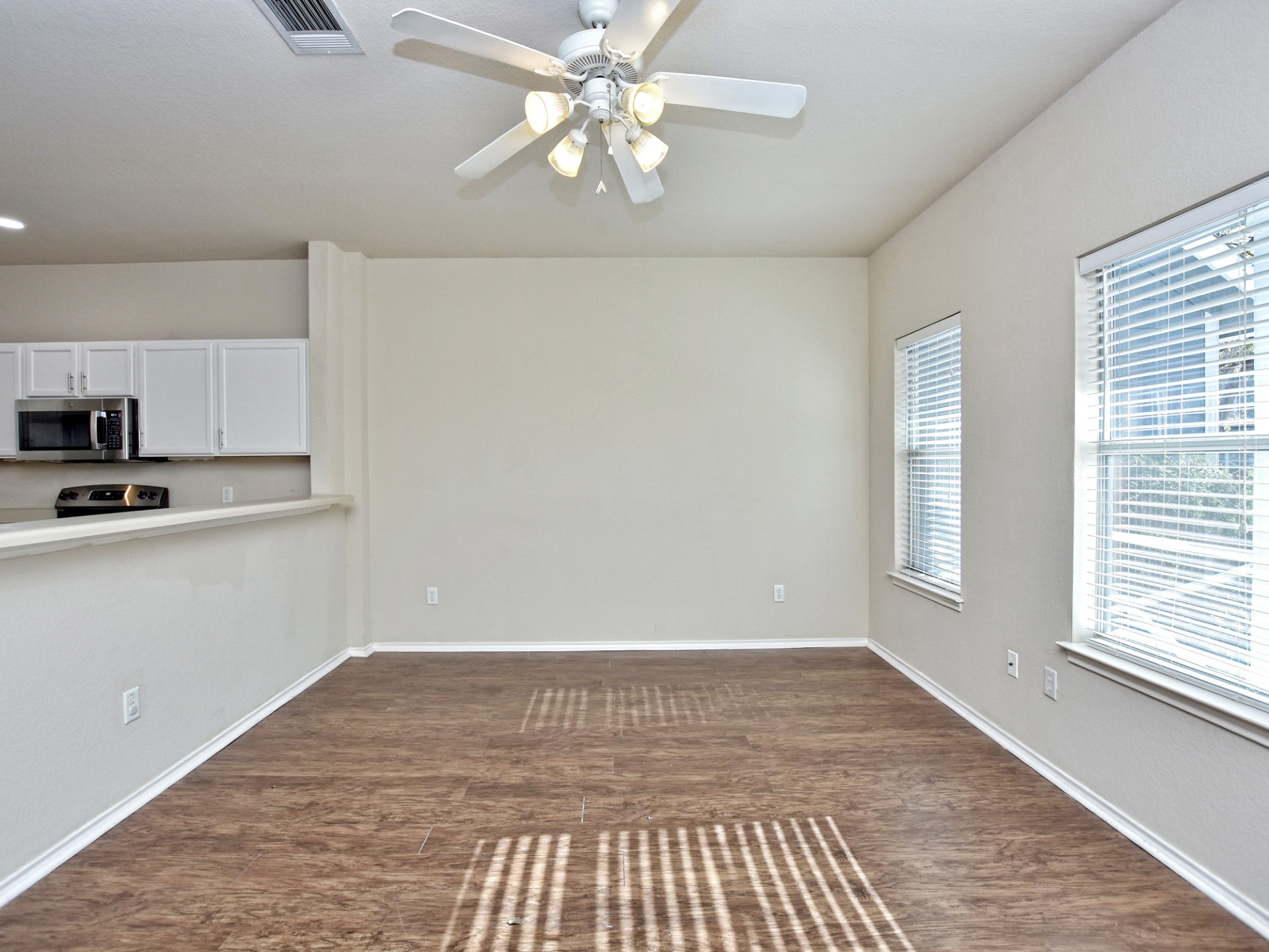 917 East 3rd Street Georgetown, TX 78626 - Photo 23 of 23 An open floorplan with durable flooring and natural light provides a versatile living space.