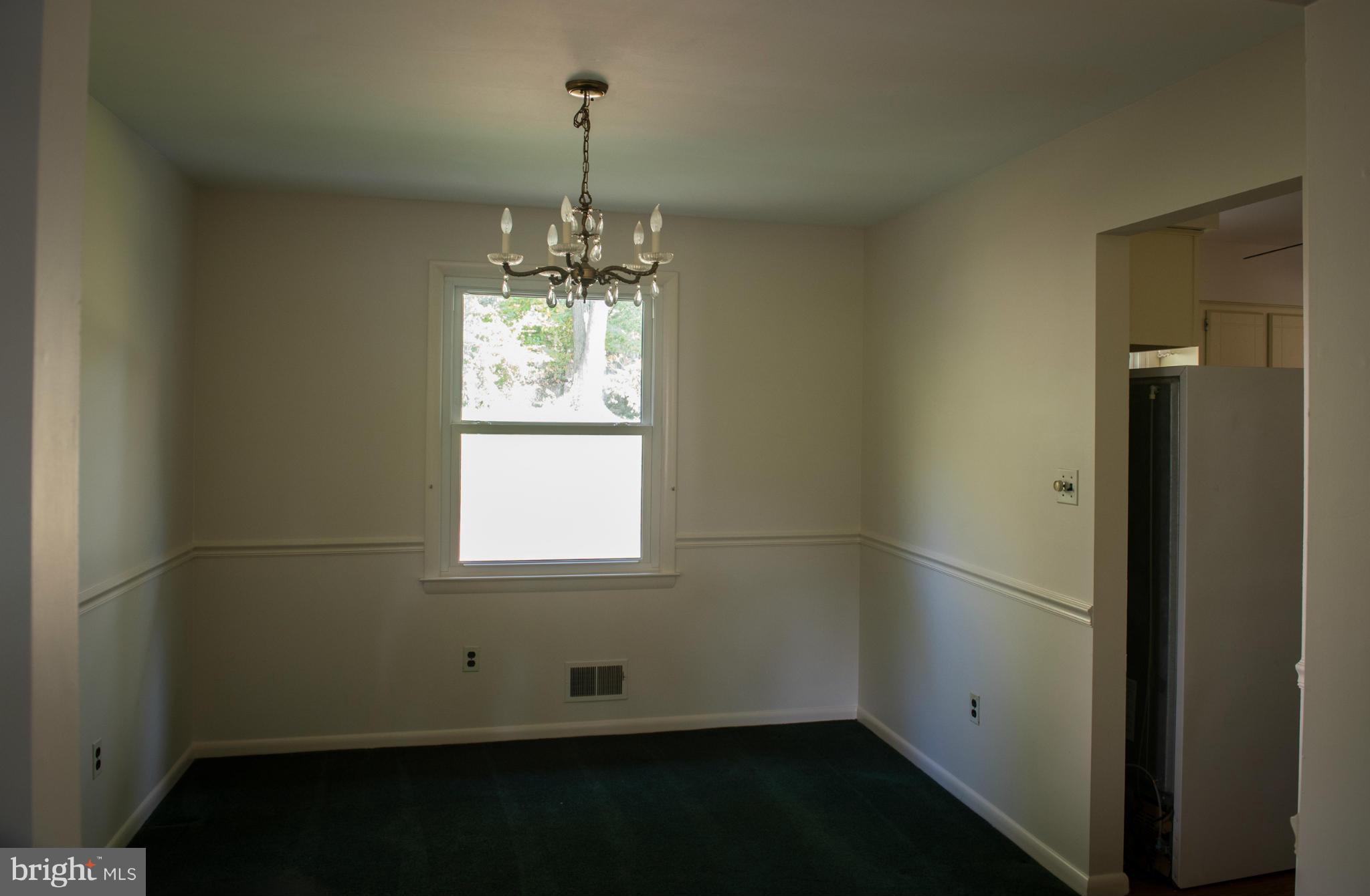 3213 Llewellyn Field Road Olney, MD 20832 - Photo 16 of 30 a room with window and chandelier