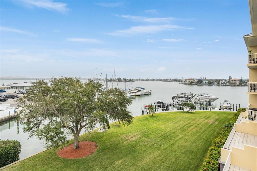 425 150th Avenue, Unit 2401 Madeira Beach, FL 33708 - Photo 1 of 1 a view of a lake with houses in the back
