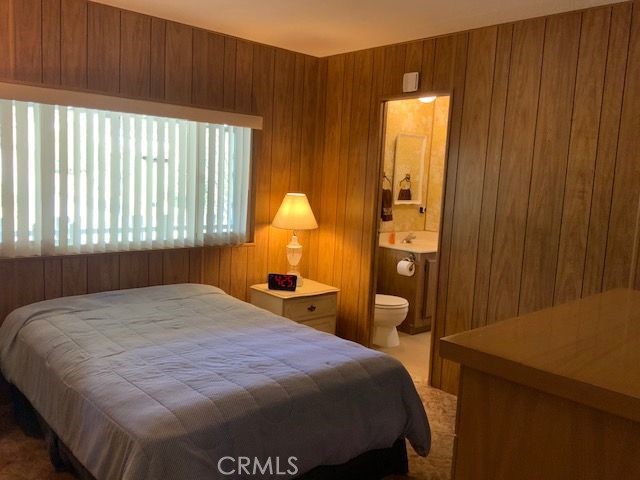 121 Larch Court Bodfish, CA 93205 - Photo 17 of 27 a bedroom with a bed and wooden floor