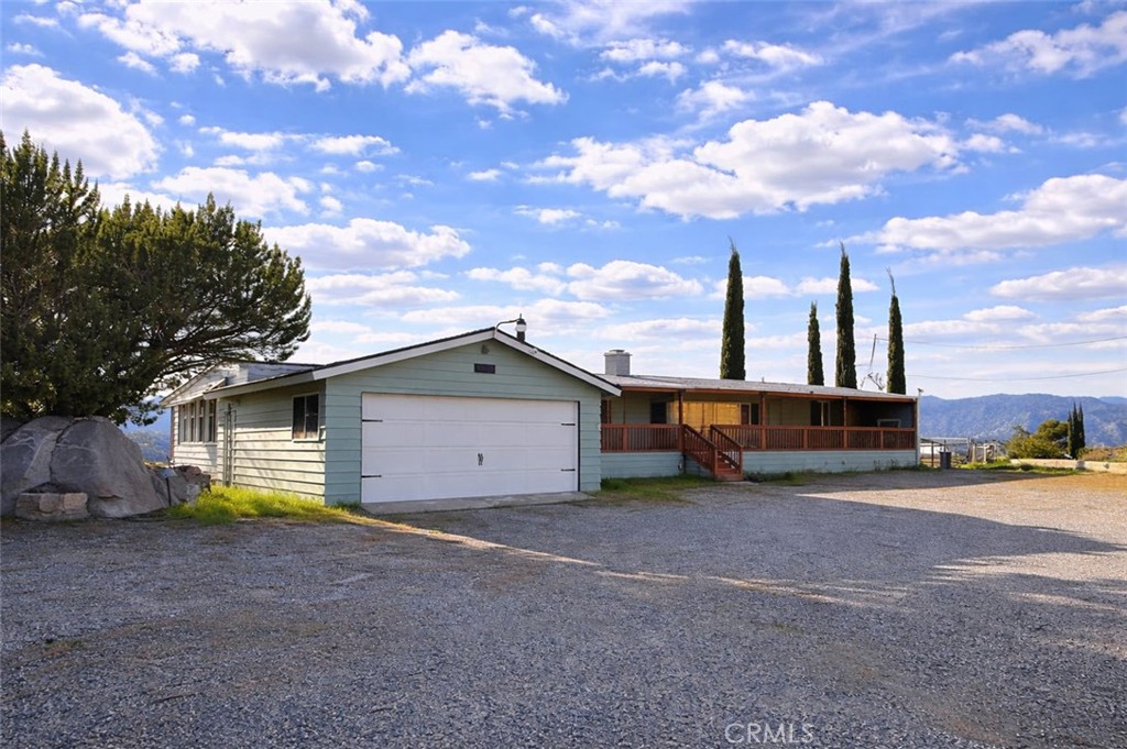121 Larch Court Bodfish, CA 93205 - Photo 2 of 27 a view of a house with a backyard