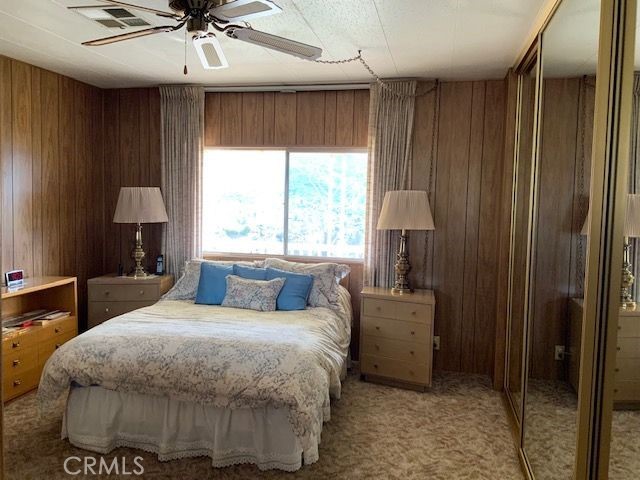 121 Larch Court Bodfish, CA 93205 - Photo 6 of 23 a bedroom with a bed and a chandelier