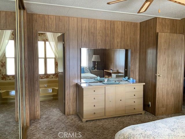 121 Larch Court Bodfish, CA 93205 - Photo 7 of 23 a bedroom with a bed and a flat screen tv