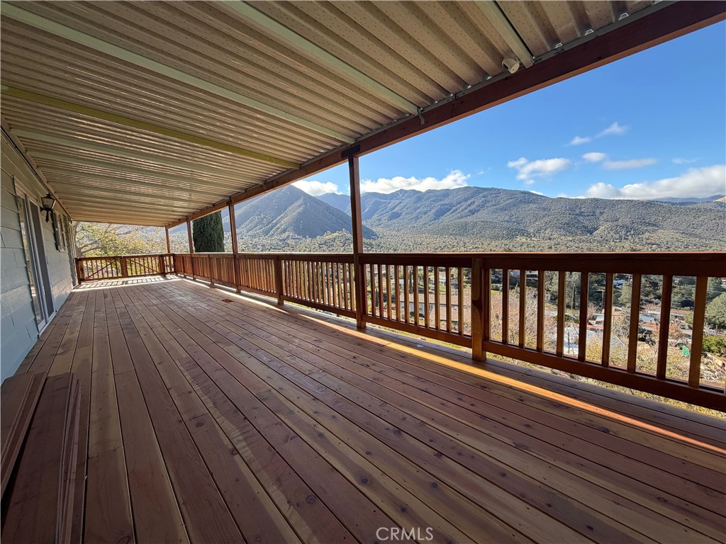 121 Larch Court Bodfish, CA 93205 - Photo 7 of 27 a view of a balcony with wooden floor