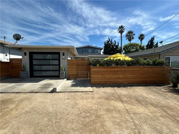 a white stove top oven sitting inside of a kitchen