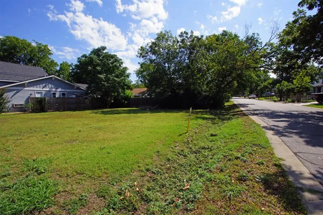 a view of yard with swimming pool and green space