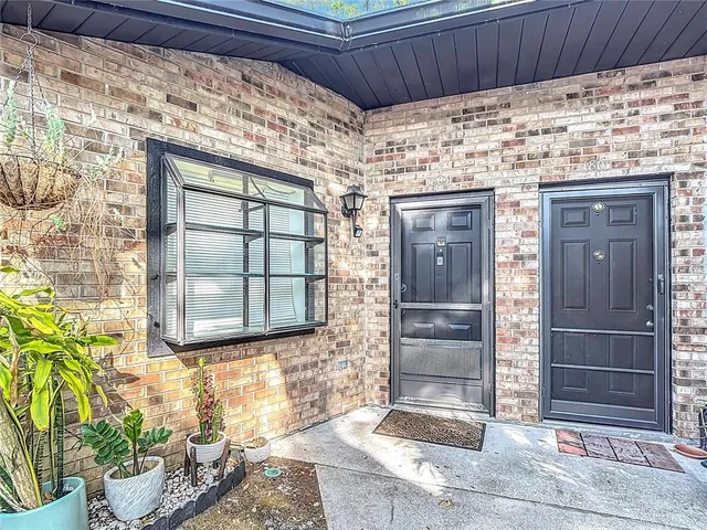 a view of front door of house with wooden door