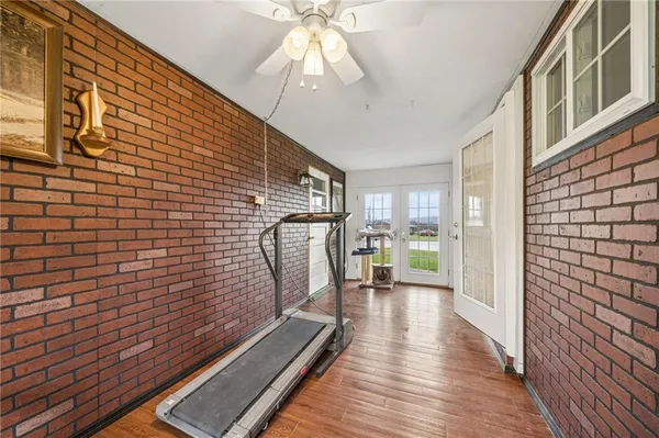 a view of a patio with wooden floor