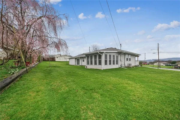 a view of a house with a big yard