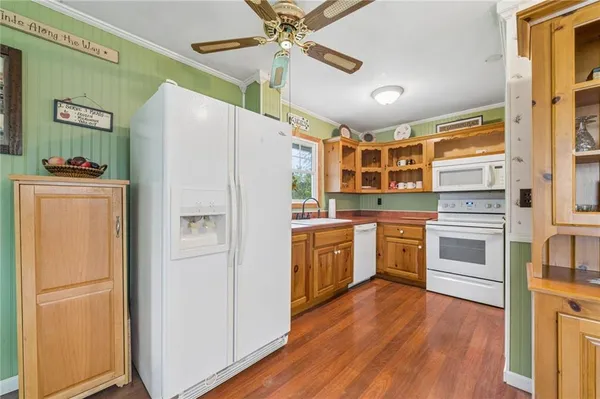 a kitchen with a refrigerator a sink and dishwasher