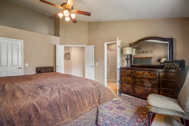 a bathroom with a bathtub a sink and a large mirror