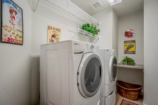 a view of a house with a yard and tree s