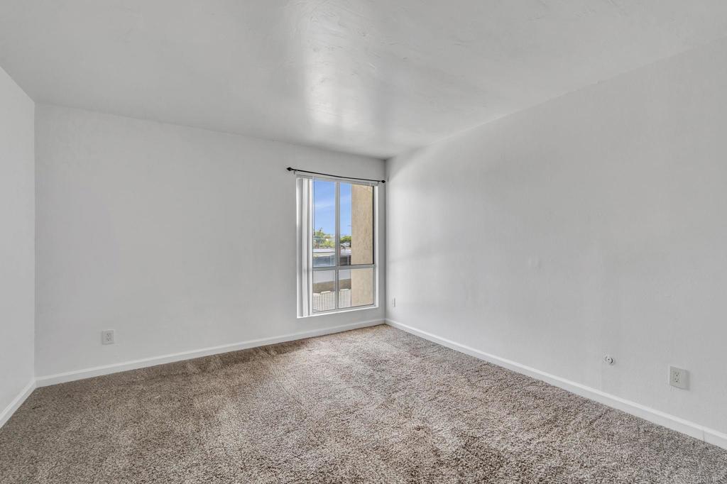 3571 Ruffin Road, Unit 239 San Diego, CA 92123 - Photo 20 of 33 an empty room with windows