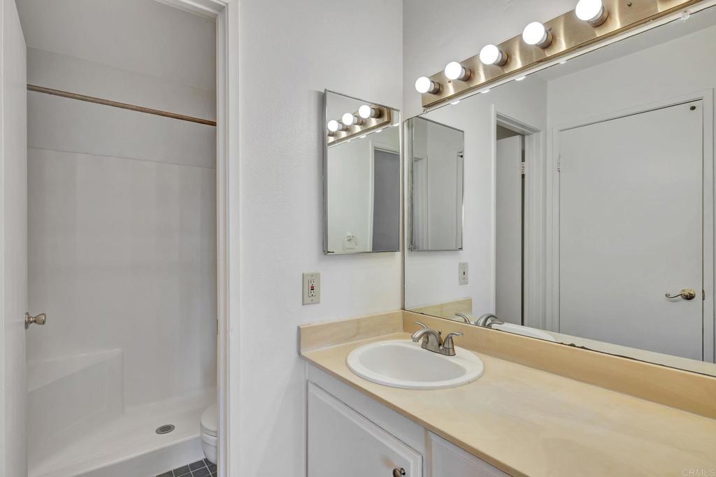3571 Ruffin Road, Unit 239 San Diego, CA 92123 - Photo 26 of 33 a bathroom with a sink and a mirror