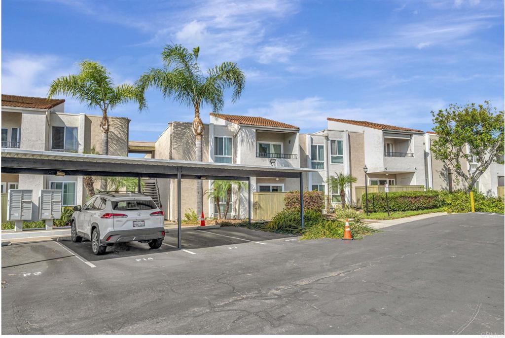 3571 Ruffin Road, Unit 239 San Diego, CA 92123 - Photo 31 of 33 a car parked in front of a house