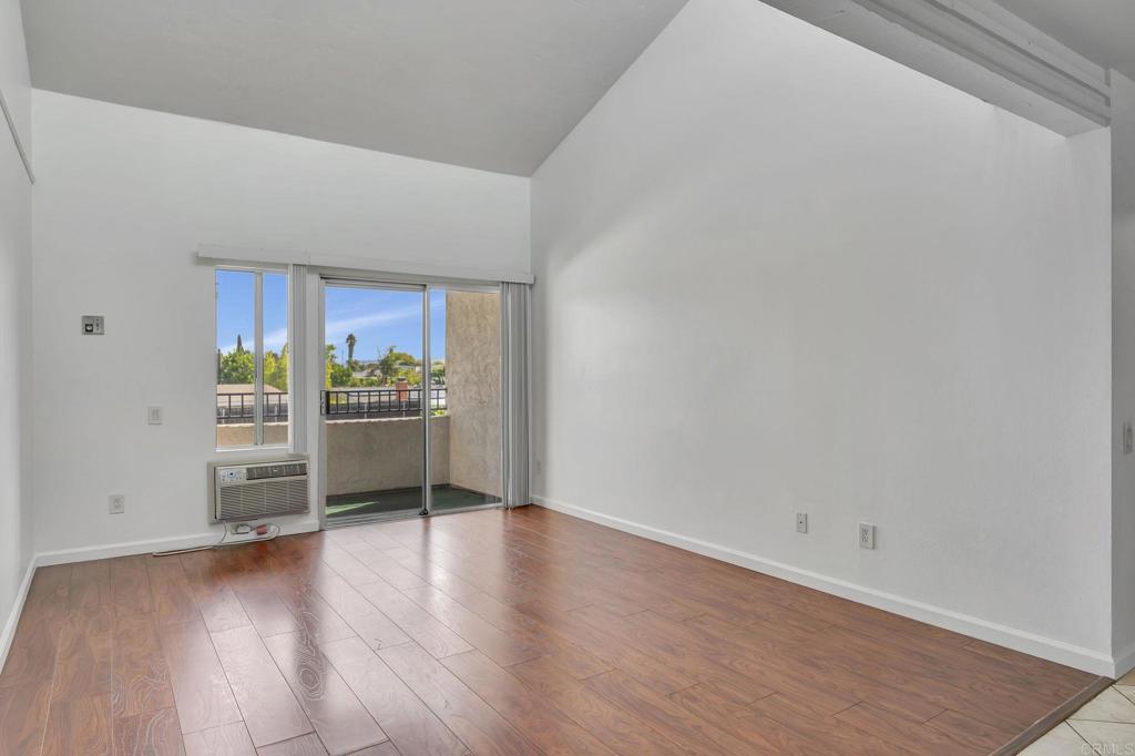 3571 Ruffin Road, Unit 239 San Diego, CA 92123 - Photo 5 of 33 a view of a kitchen with wooden floor and a sink