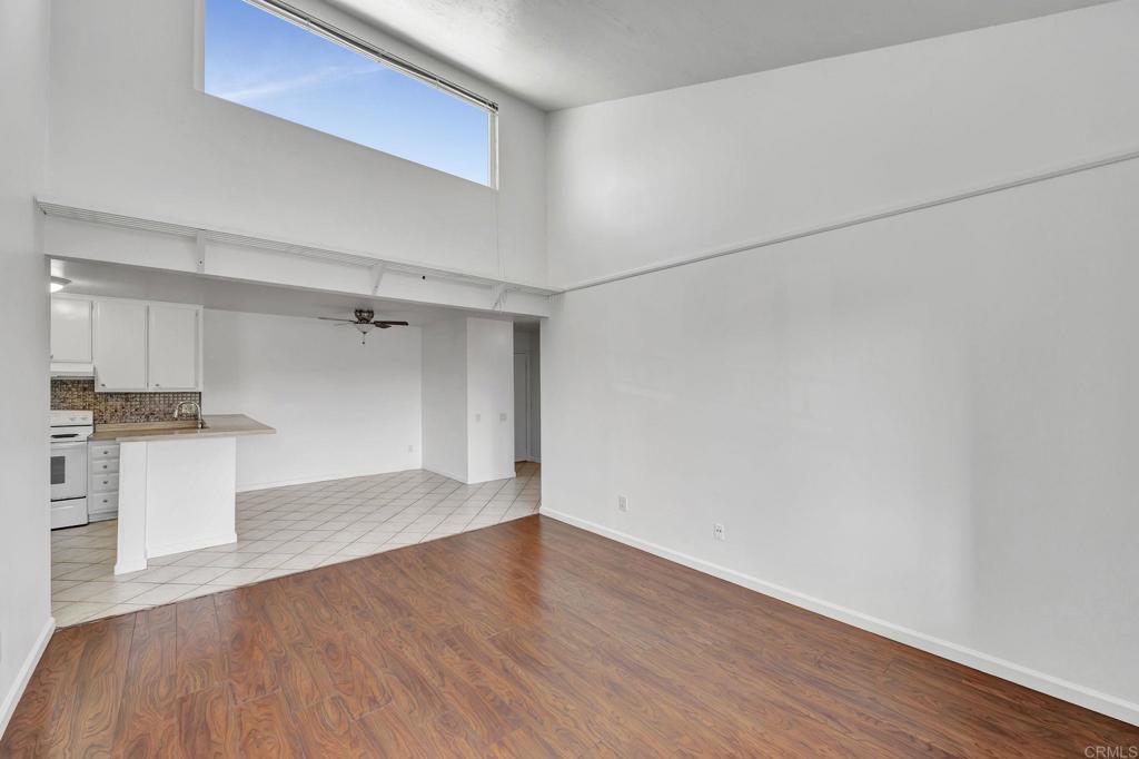 3571 Ruffin Road, Unit 239 San Diego, CA 92123 - Photo 8 of 33 a view of a kitchen with wooden floor and a sink