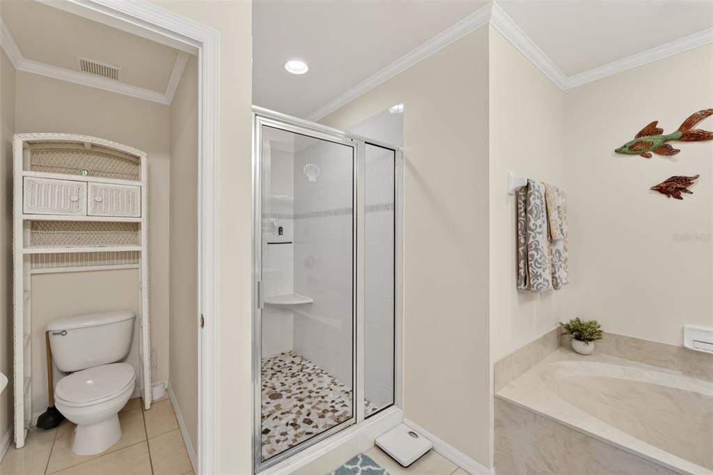 2060 Matecumbe Key Road, Unit 2506 Punta Gorda, FL 33955 - Photo 19 of 38 a bathroom with a granite countertop sink a toilet and shower