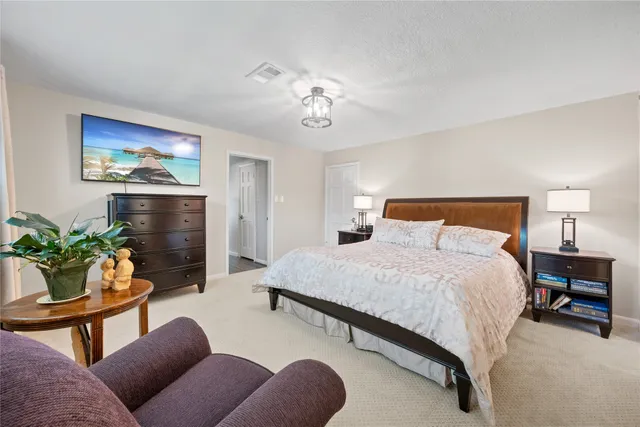 a bedroom with furniture and a bed