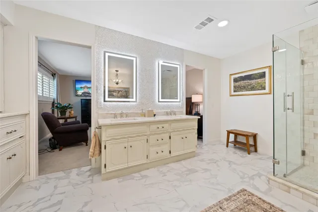 a spacious bedroom with a bed and a couch