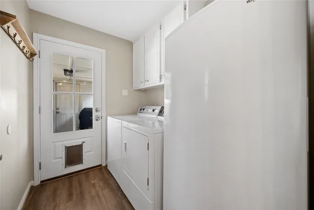 a view of hallway with washer and dryer