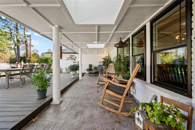 a view of a chairs and table in a patio