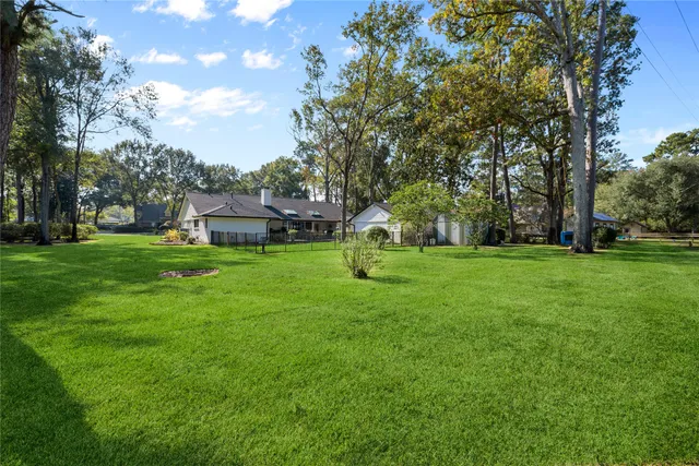 a view of a house with a backyard porch and sitting area