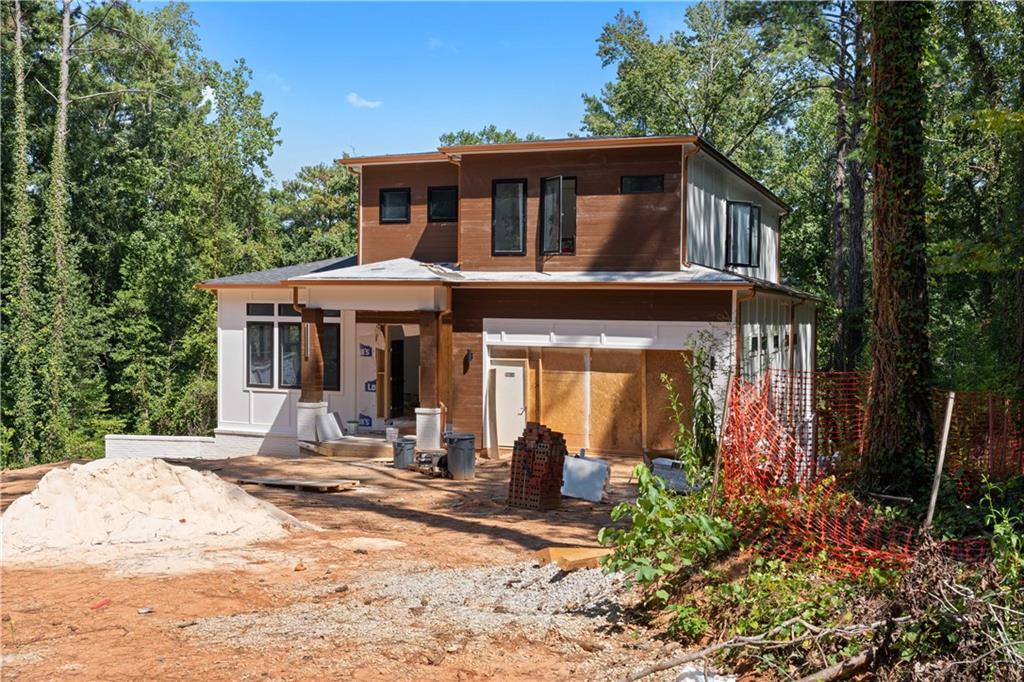 1155 Apollo Drive Southwest Atlanta, GA 30331 - Photo 5 of 7 a front view of a house with garden