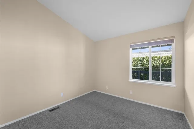 a bathroom with a sink toilet a mirror and shower
