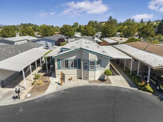 an aerial view of a house with a swimming pool