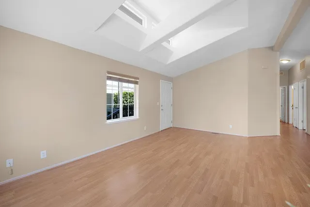 a view of an empty room with a potted plant