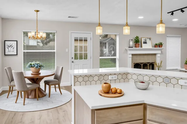 a dining room with furniture and window