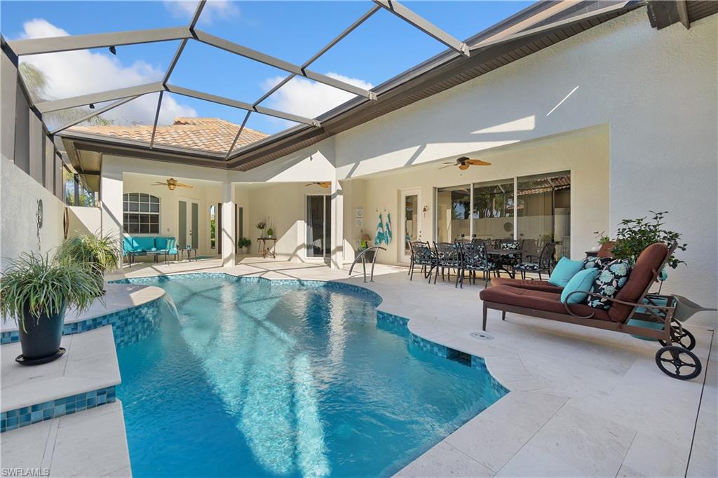 12612 Grandezza Circle Estero, FL 33928 - Photo 2 of 48 View of swimming pool with a patio, a lanai, and ceiling fan