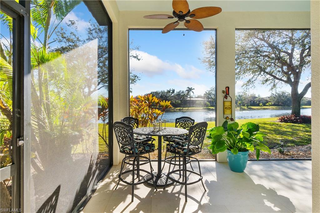 12612 Grandezza Circle Estero, FL 33928 - Photo 24 of 48 Sunroom with ceiling fan and a water view