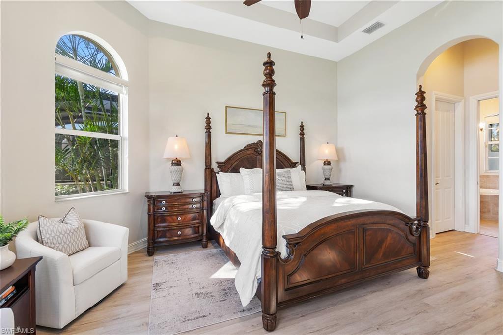 12612 Grandezza Circle Estero, FL 33928 - Photo 28 of 48 Bedroom featuring light wood-type flooring