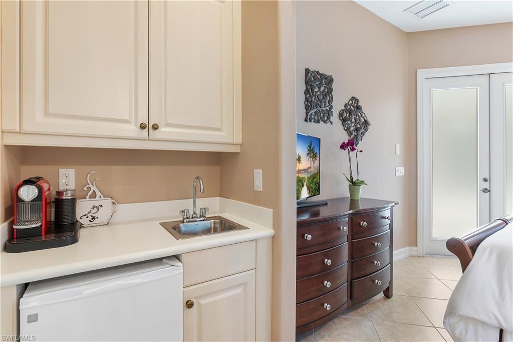 12612 Grandezza Circle Estero, FL 33928 - Photo 37 of 48 Kitchen featuring dishwasher, sink, and light tile patterned floors