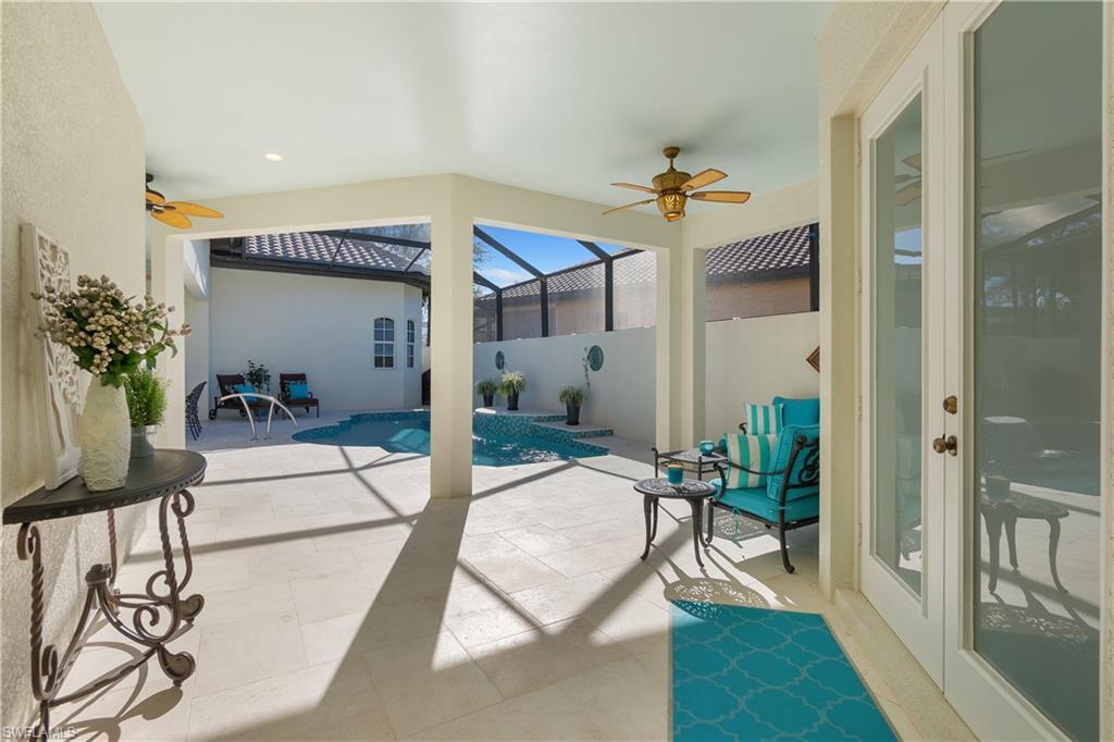 12612 Grandezza Circle Estero, FL 33928 - Photo 10 of 48 View of patio with ceiling fan, a fenced in pool, and glass enclosure
